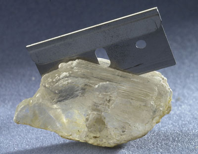 Photograph of gypsum cloven with a razor blade