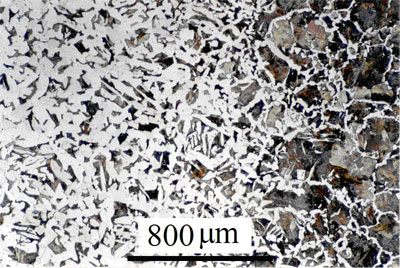 Micrograph of A carburised steel, showing increased  carbon content on the outer surface