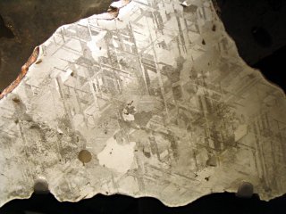 Photograph of a section through an Fe-Ni meteorite showing plates at 60° to each other