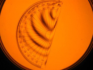 Photograph of a protractor viewed through a plane polariscope