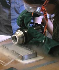 Photograph of liquid nitrogen being poured into the tray
