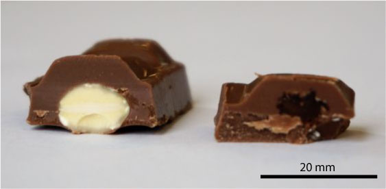 Photograph of dairy milk fruit and nut bar in cross-section